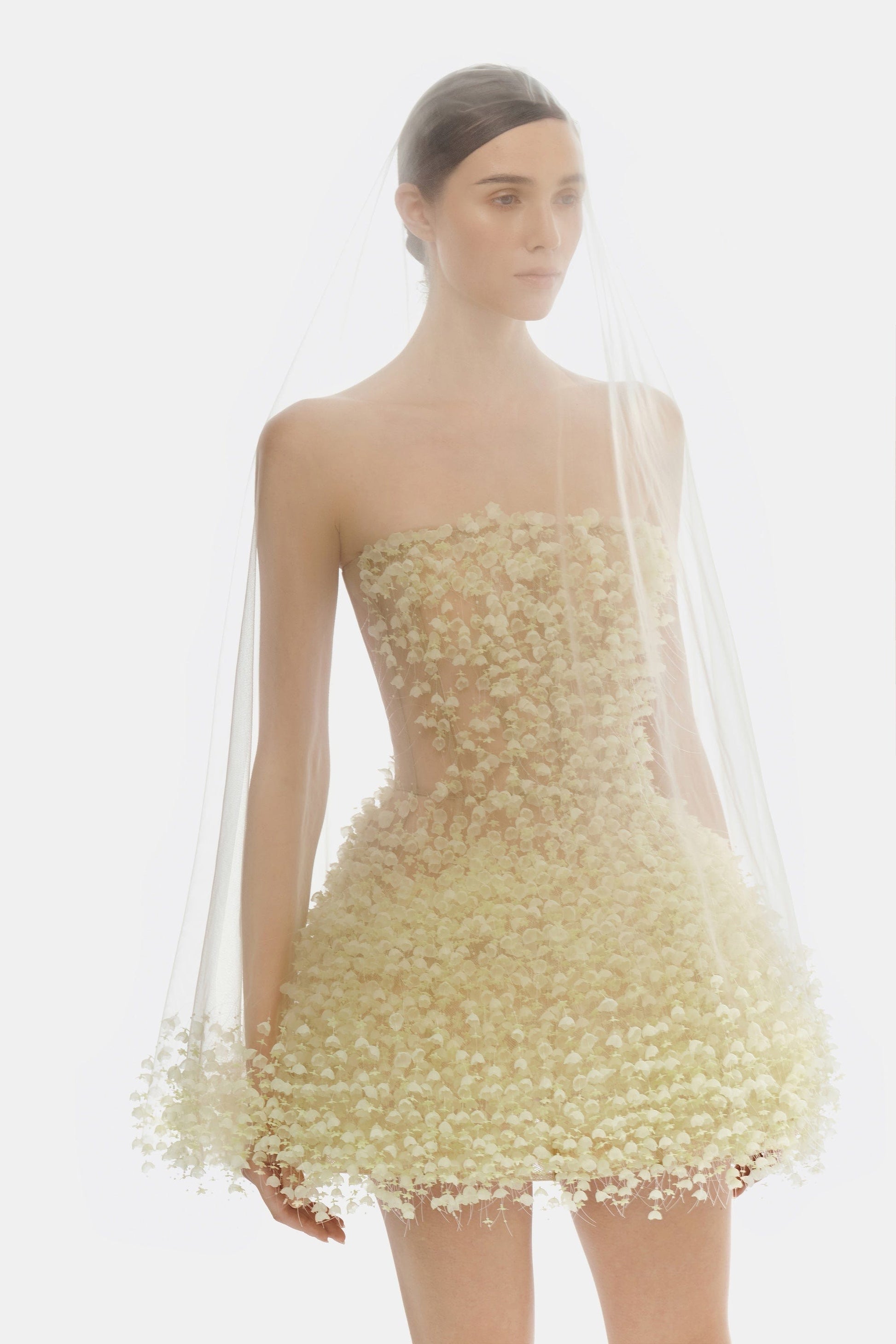 Woman in floral mini dress and veil