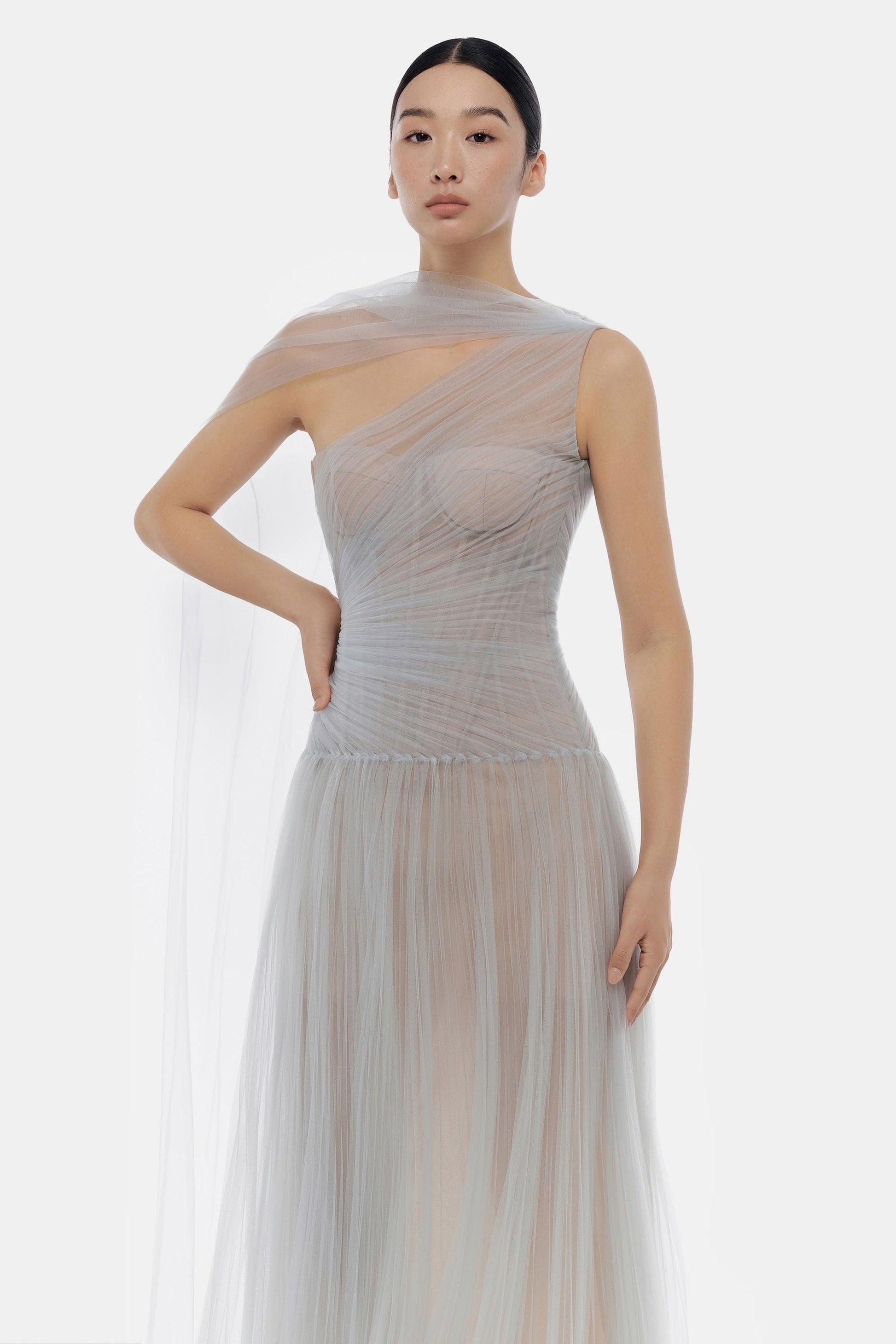 Asymmetrical draped tulle gown