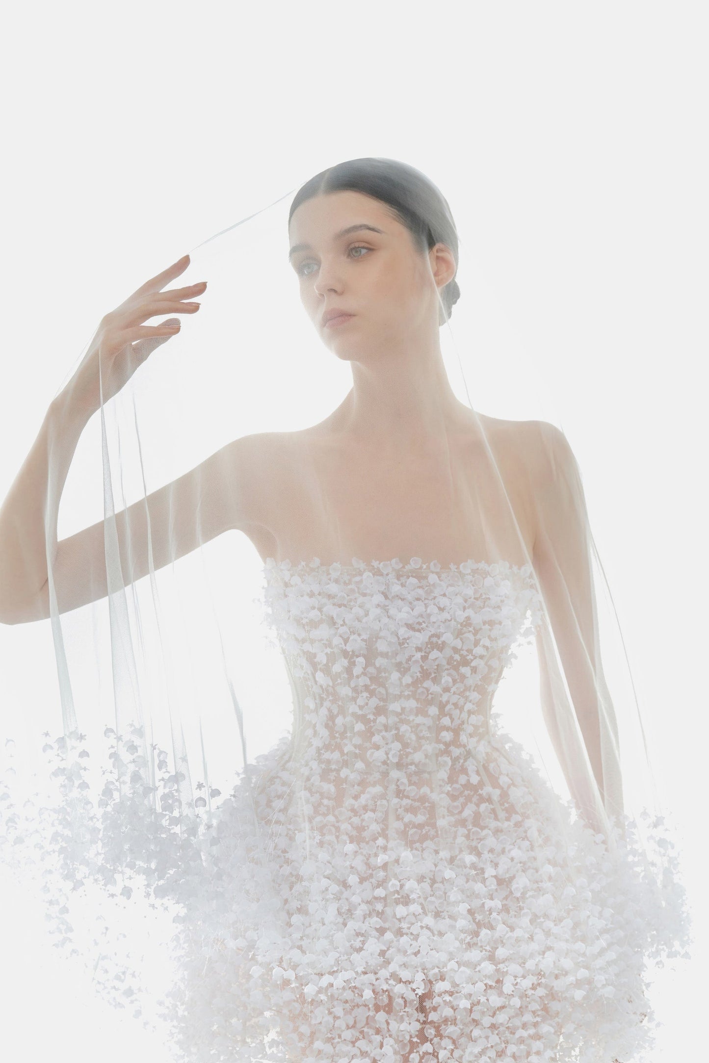Bride in white floral dress with veil