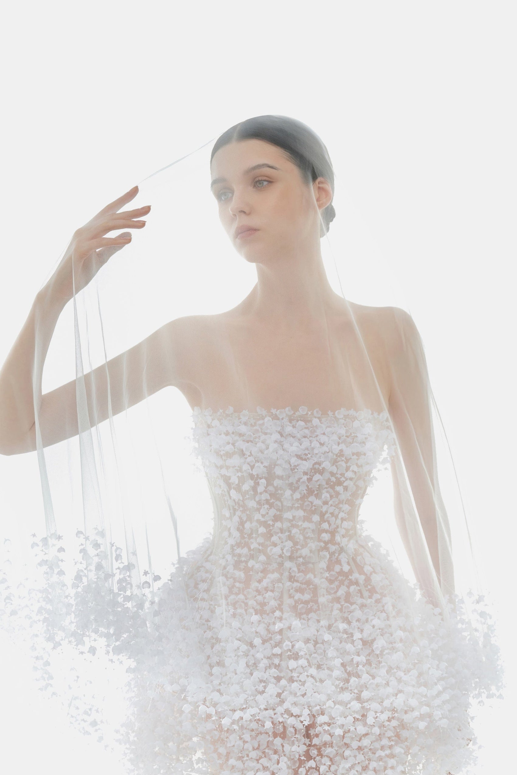 Bride in white floral dress with veil