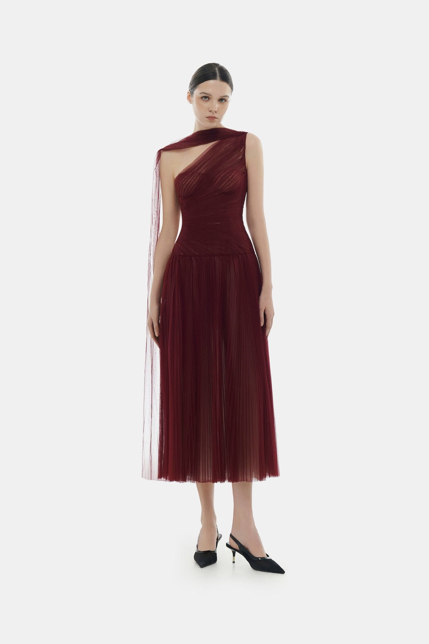 Woman in burgundy one-shoulder dress
