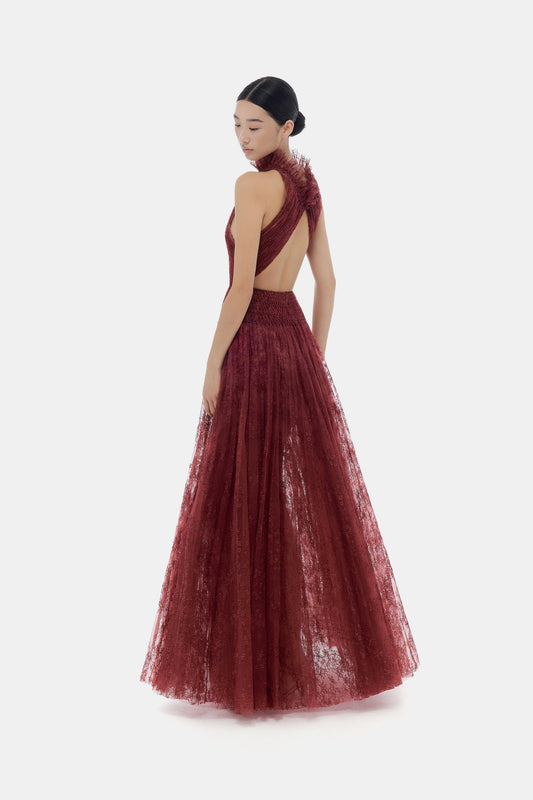 Woman in burgundy gown, back view